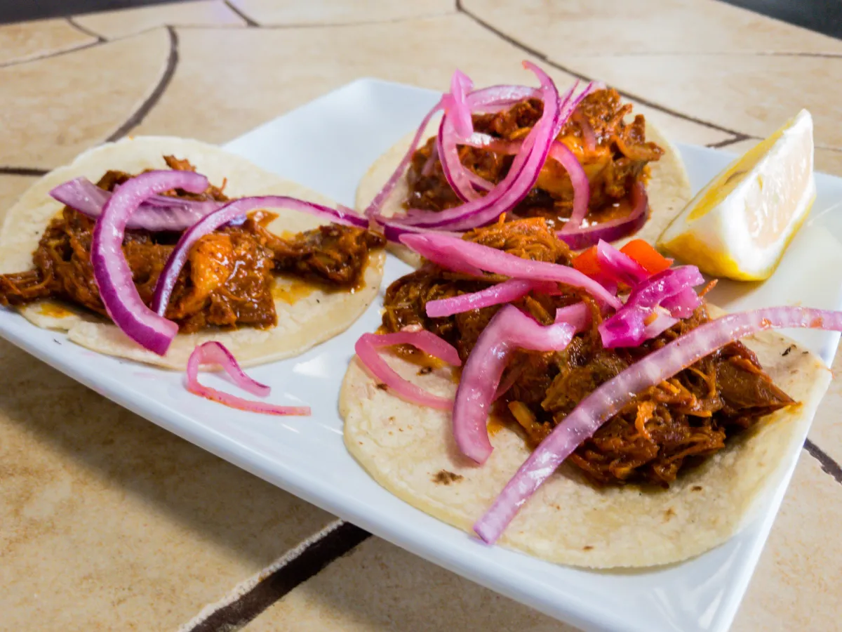 Tulum OC signature dishes Cochinita PibilChile VerdeCheese Chile RellenoChicken Mole